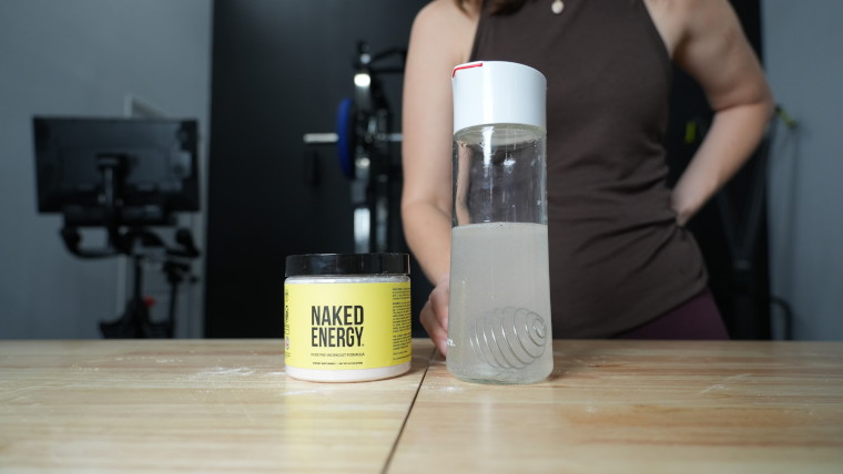 Our tester standing behind a freshly made batch of Naked Nutrition Naked Energy Pre-Workout