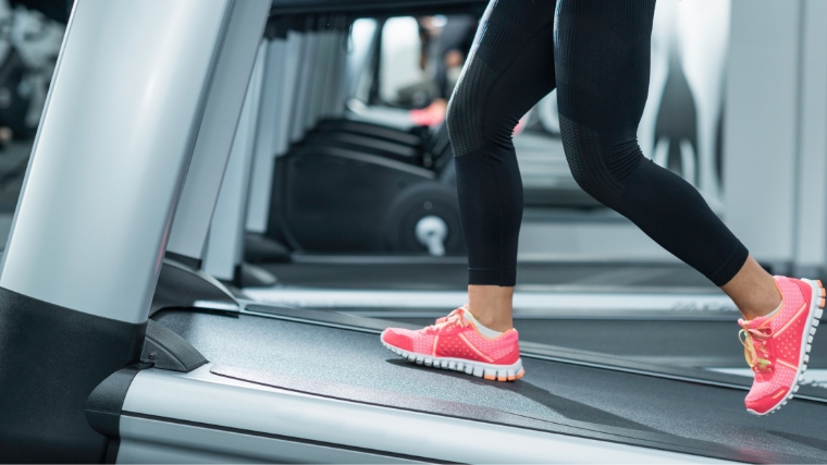 A person on an inclined treadmill.