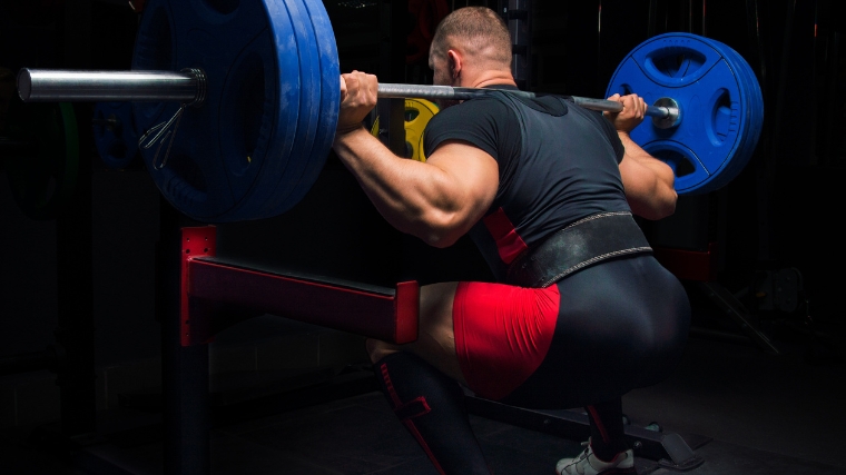 A powerlifter doing a back squat