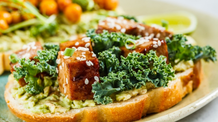 Whole wheat bread, tofu and veggies - an open sandwich.