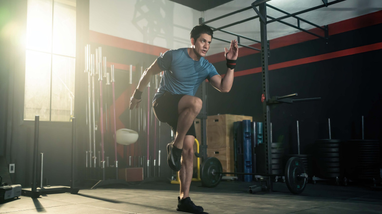 An athlete exercises in the gym.