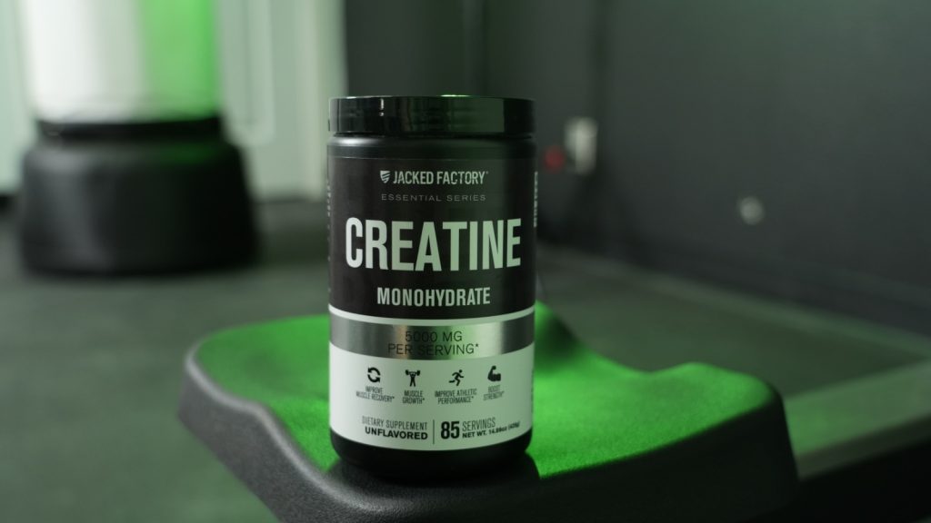 A jar of Jacked Factory creatine being tested in the BarBend gym.