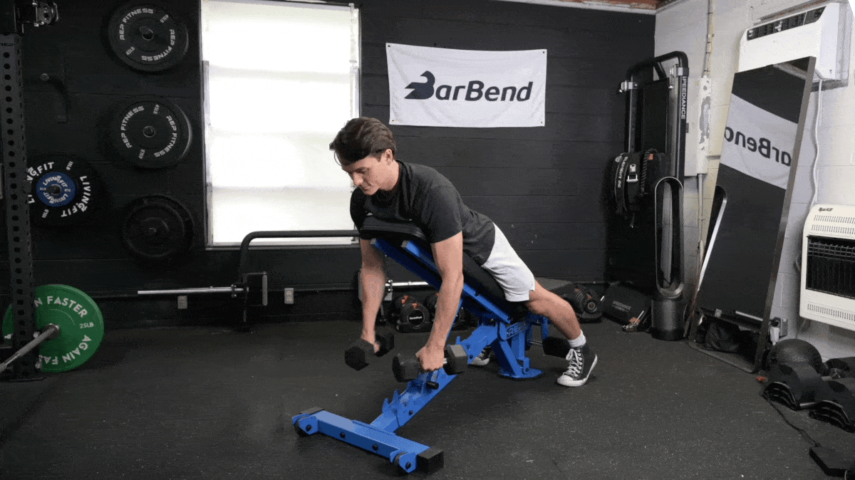 A person doing an incline y raise exercise.