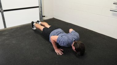 A person doing push-ups.