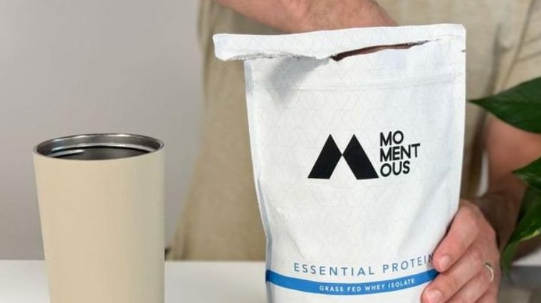 Our tester reaching into a bag of Momentous Whey