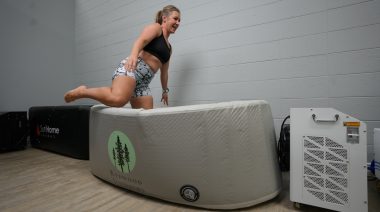 BarBend tester stepping into Redwood Yukon tub.