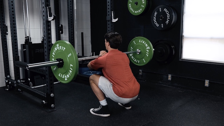 Jake Front Squatting with the Living.Fit Barbell