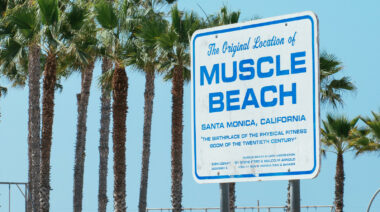 A sign for Muscle Beach in Santa Monica, California.