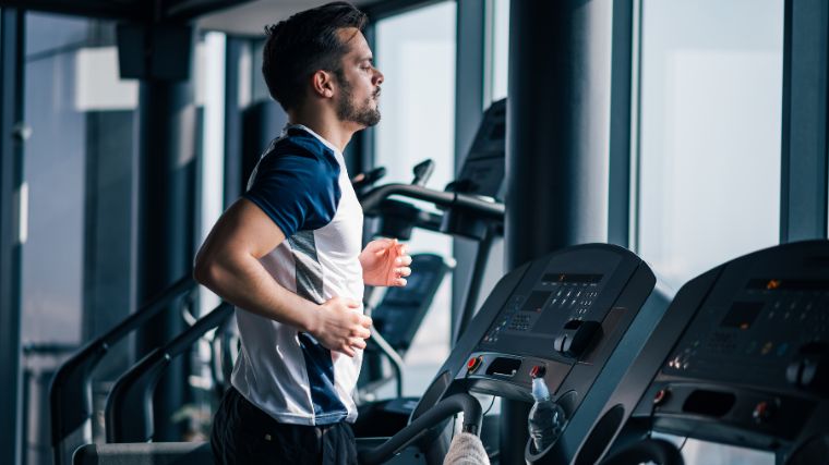 A gymgoer on a treadmill doing cardio.