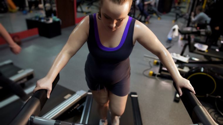 A person doing an intense treadmill workout.