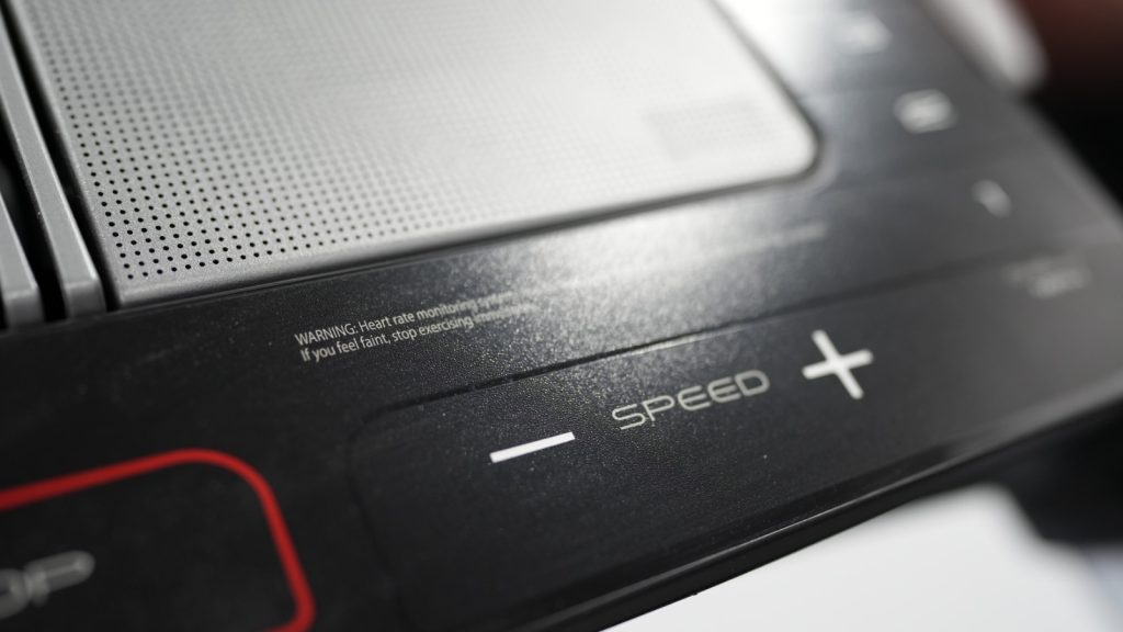 Close up view of the speed controls on a NordicTrack X22i treadmill.