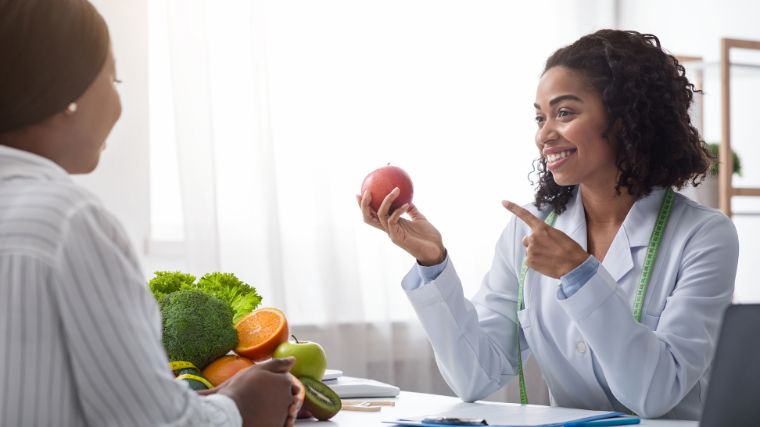 A certified nutritionist giving advice to a client.