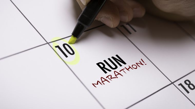 Setting a goal to run a marathon.