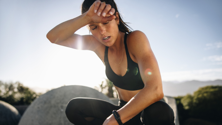 A woman sweating after a workout.