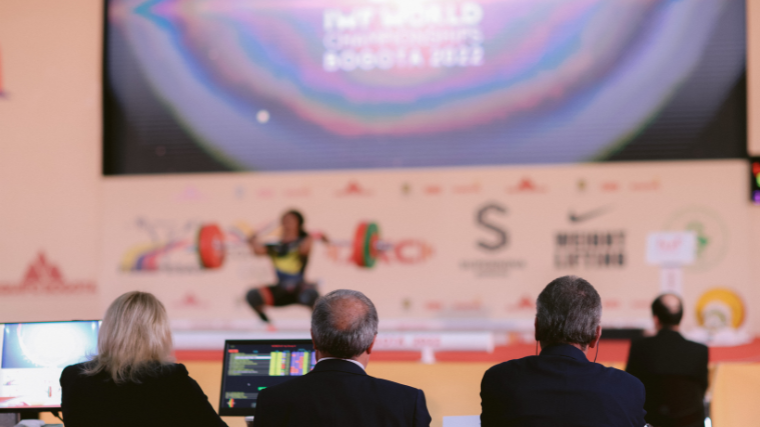 IWF officials spectate the 2022 World Weightlifting Championships.