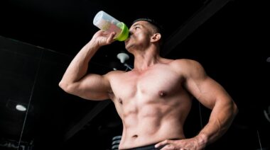 An athlete drinks pre-workout.