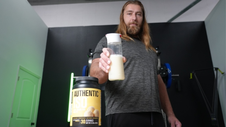 Tester holding Jacked Factory Authentic ISO in a bottle. 