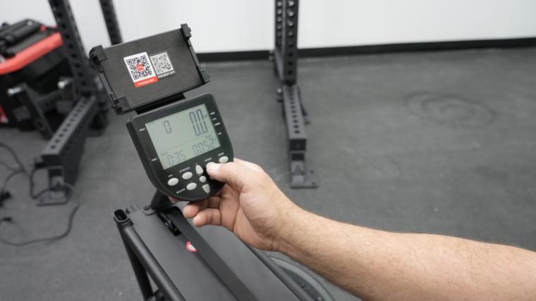 A person using the LCD screen on the Yosuda Water Rowing Machine