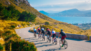 A group of people cycling in the daytime