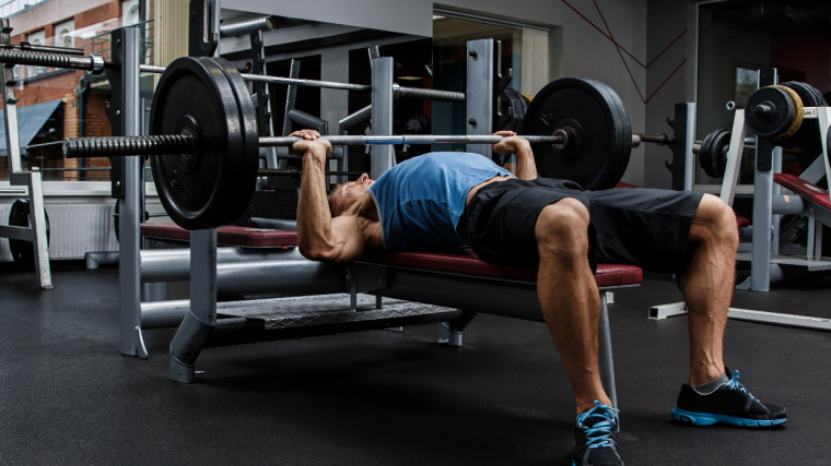 A person doing the bench press.