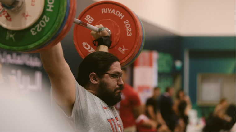 Caine Wilkes practices at the 2023 World Weightlifting Championships