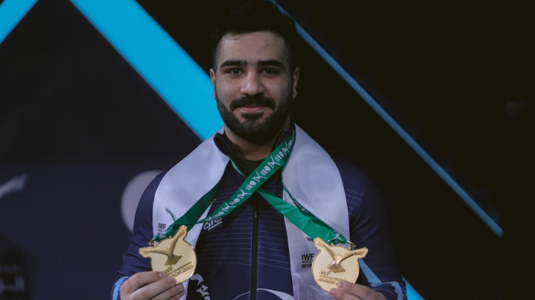 Weightlifter Mir Mostafa Javadi shows off his gold medals.