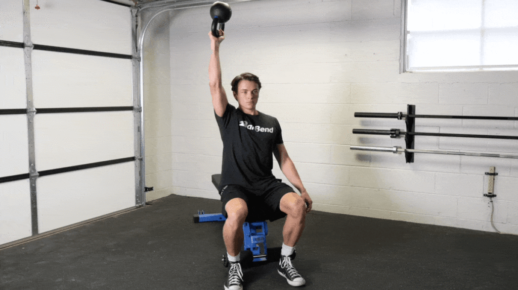 A person doing the Bottoms-Up Kettlebell Press.