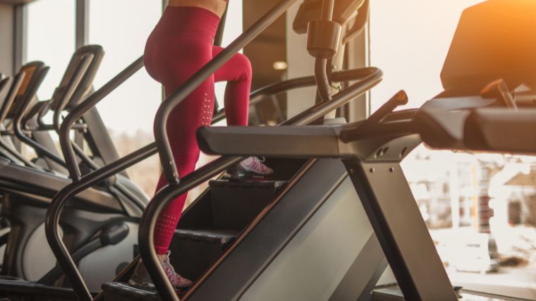 A person working out on a stair climber.