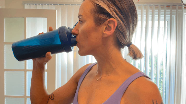 Woman tests a protein shake