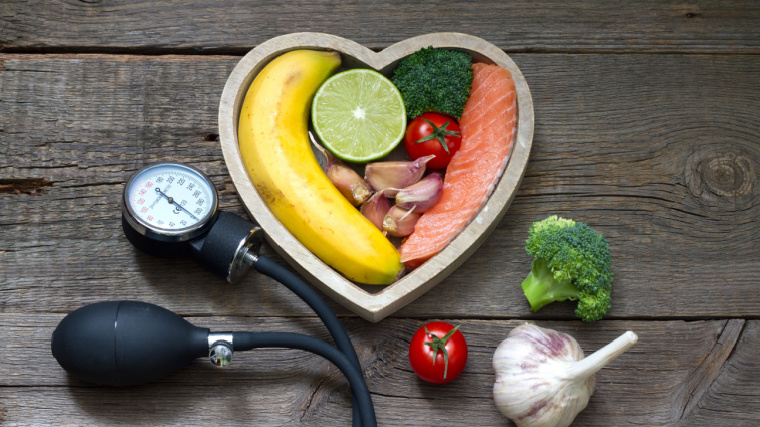 Health heart diet food concept with blood pressure gauge.