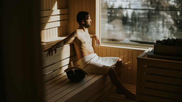 A person relaxing in a sauna.