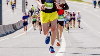 People running a marathon uphill.