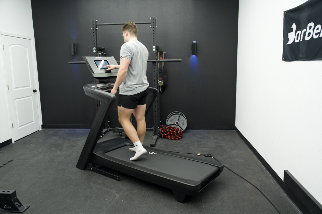 A person walking on the NordicTrack Commercial 1250 Treadmill.