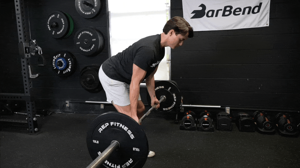 A person doing the bent over row with a barbell.