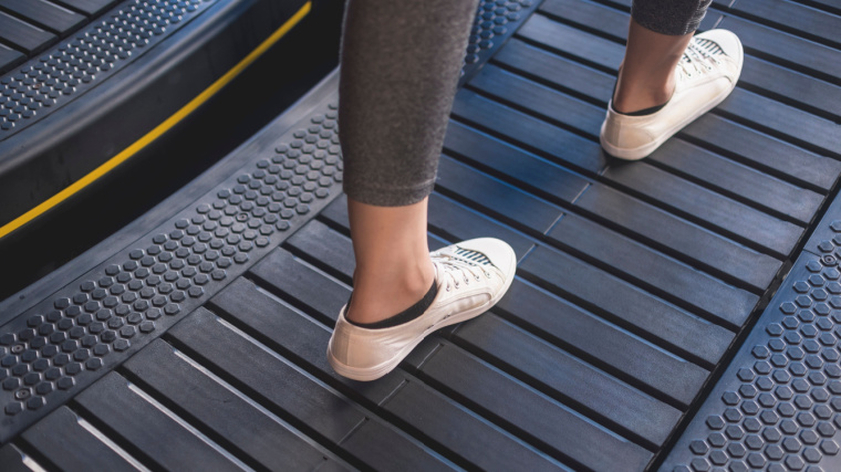 A woman walking on an Assault Runner Elite self-propelled treadmill