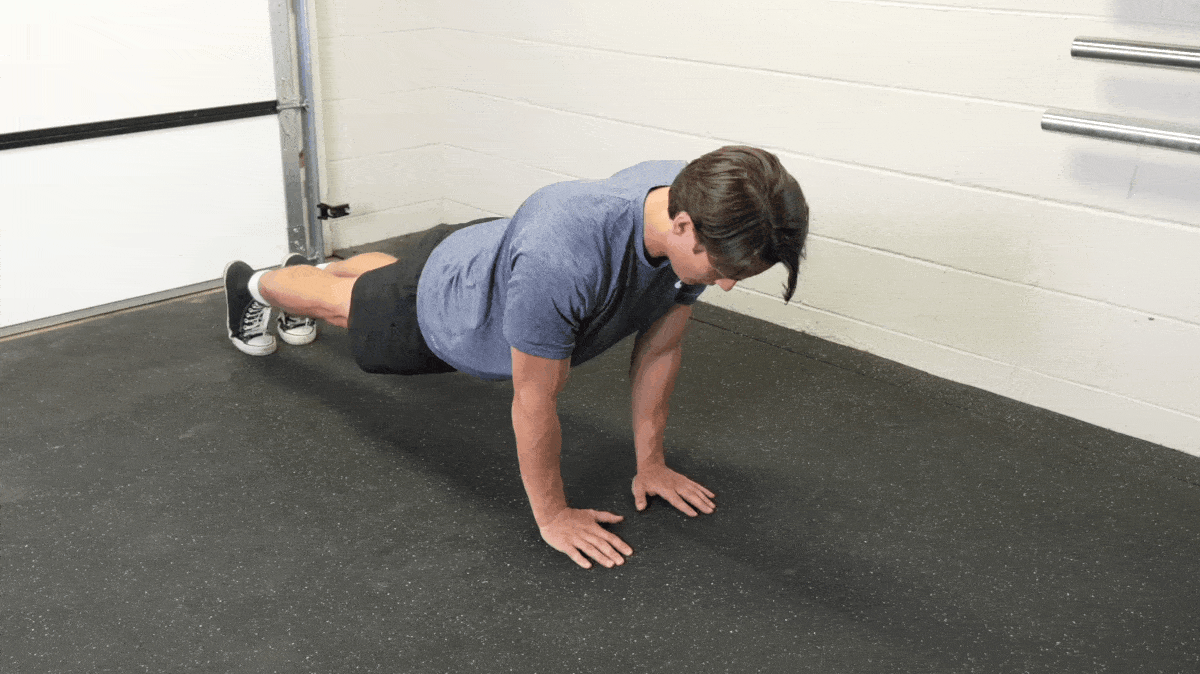 A person doing a close grip push-up.