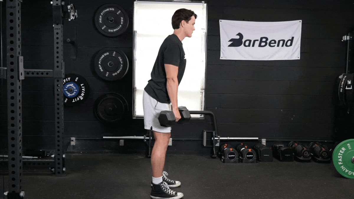 A person doing dumbbell shrugs.