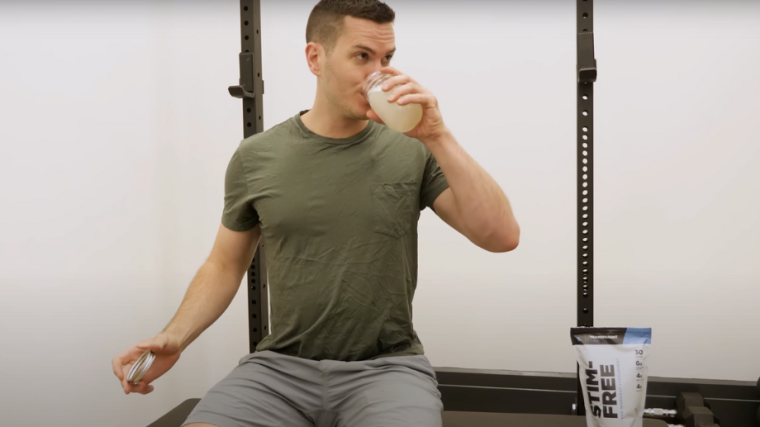 A BarBend tester drinking Transparent Stim-Free pre-workout.