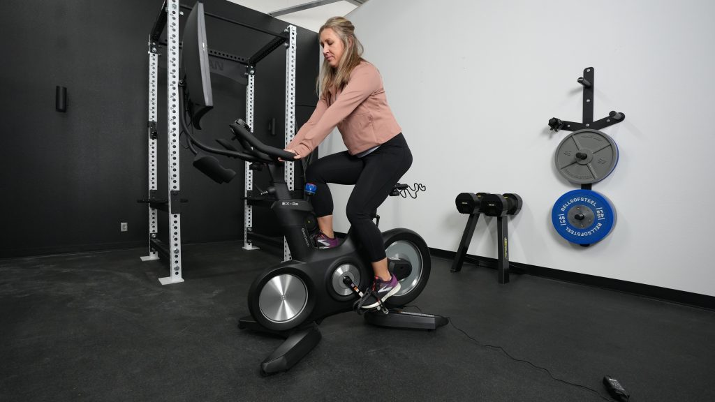 A person riding the Echelon Connect EX-8s exercise bike.