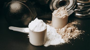 A scoop full of powdered supplements.