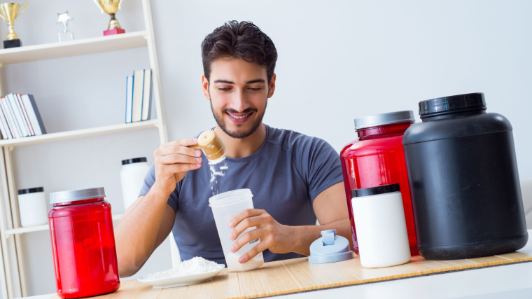 An athlete preparing a meal replacement shake.