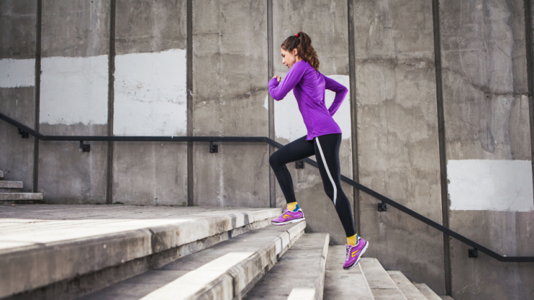 A fit person running on the stairs.