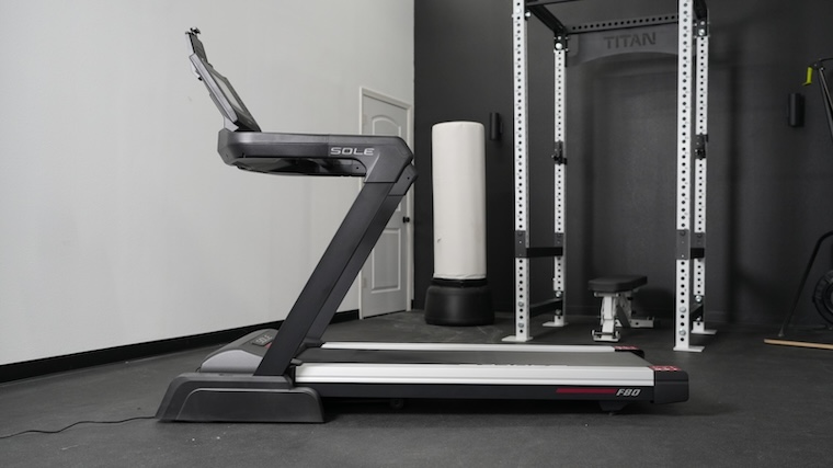 The Sole F80 treadmill is shown from the side.