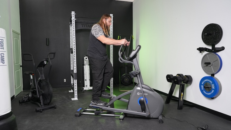 Our tester working out atop the Horizon EX-59 elliptical