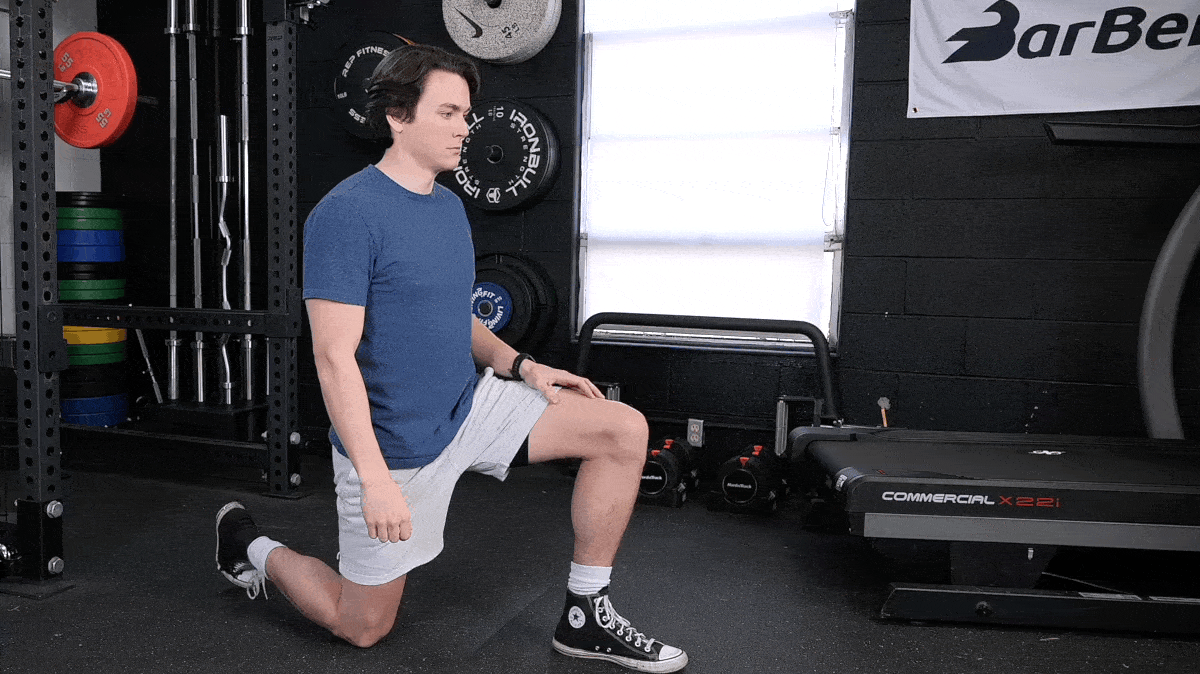 Jake demonstrating the half-kneeling stretch.