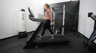 A BarBend product tester walking on the NordicTrack 1750.