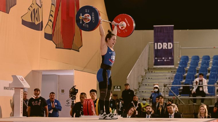 An Olympic athlete lifting a barbell.