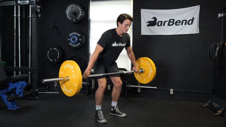 A person performing the snatch grip deadlift.