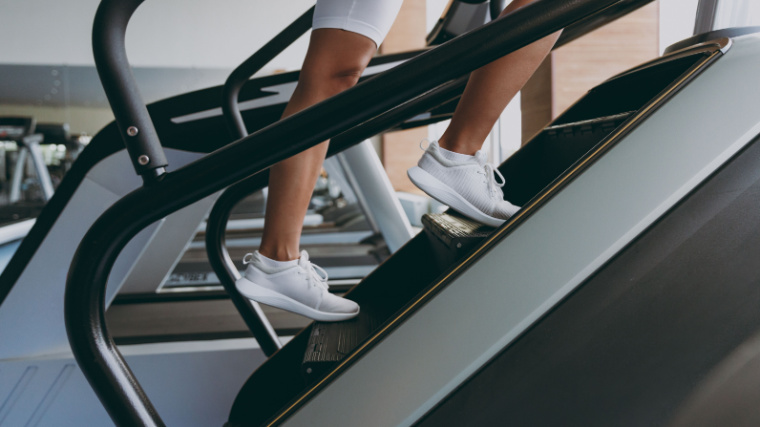 A fit person working out on a stairmaster.
