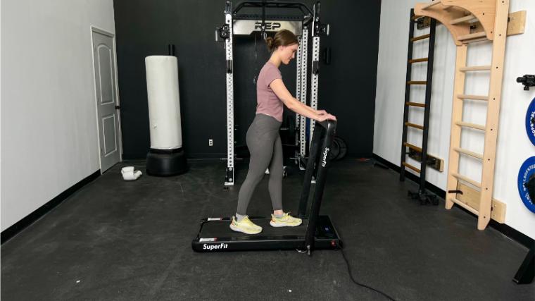 Our tester walking on the Goplus 2 in 1 Folding Treadmill.
